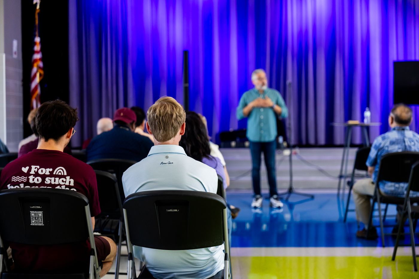 Conference audience facing the main stage